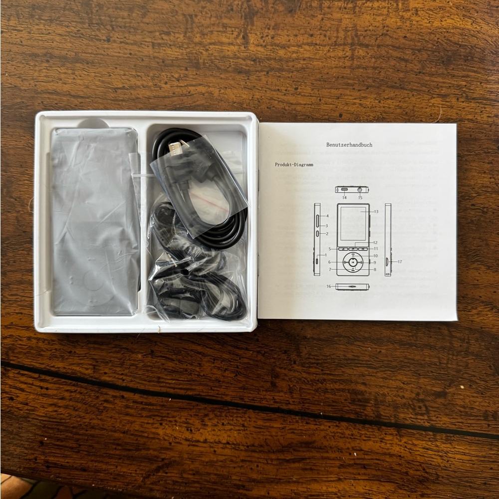 Source Unknown Black MP3 Player with Earphones